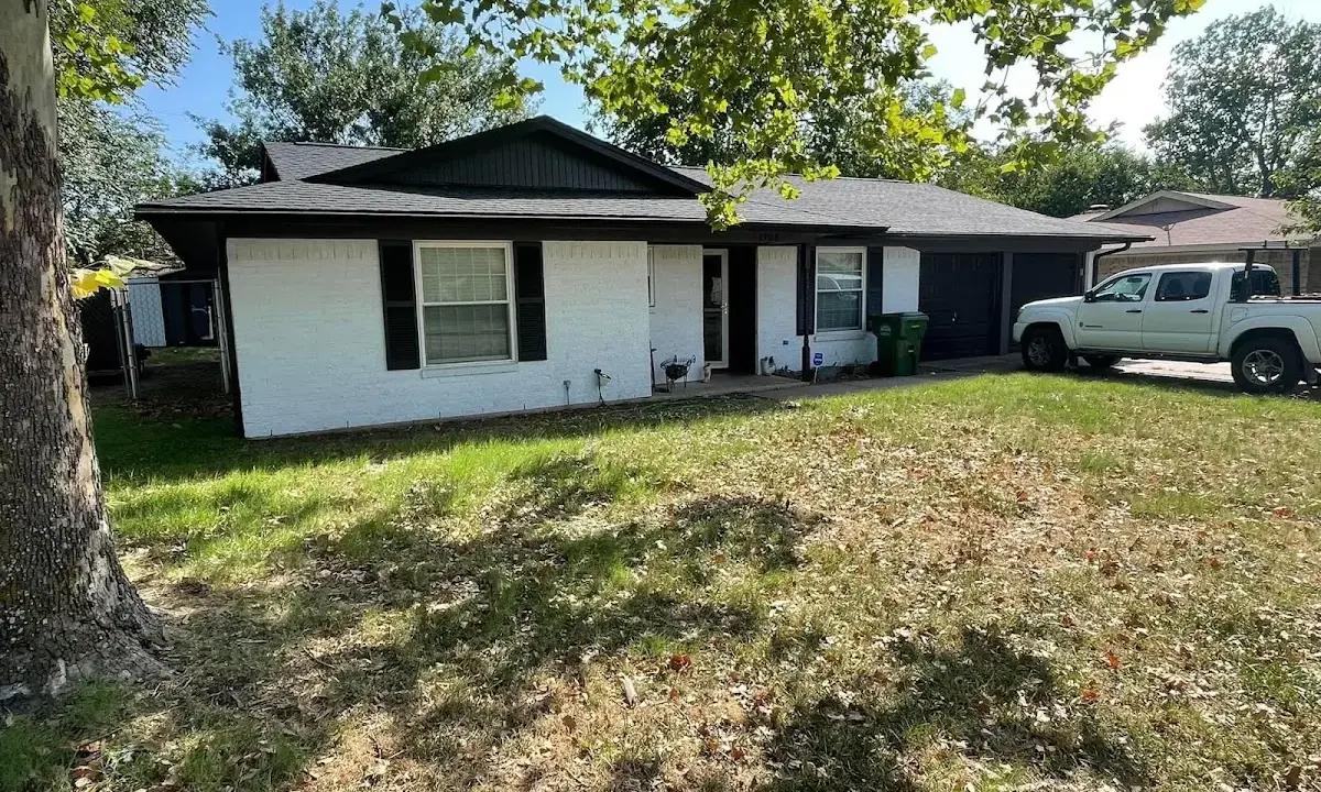 Professional roofing crew working on a residential roof in Washington